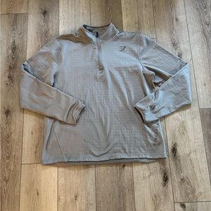 Gymshark Arrival 1/4 Zip Pullover in a light grey color